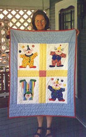 [Nana and the quilt she made for the baby]